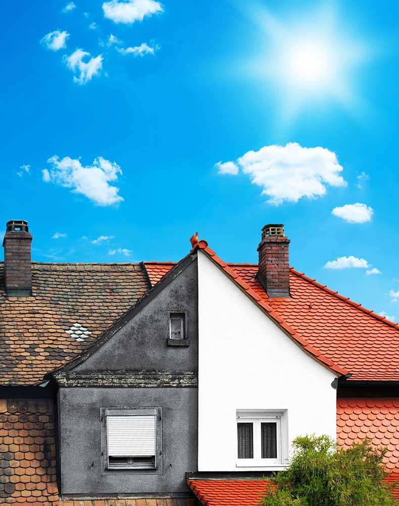 Renoviertes und nicht renoviertes Haus nebeneinander